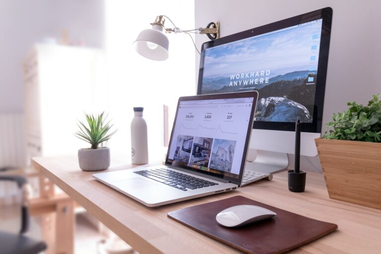 PLR Content - MacBook Pro on table beside white iMac and Magic Mouse